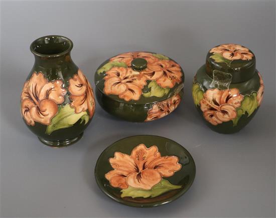 A Moorcroft hibiscus vase, two lidded jars and a pin dish vase 14cm